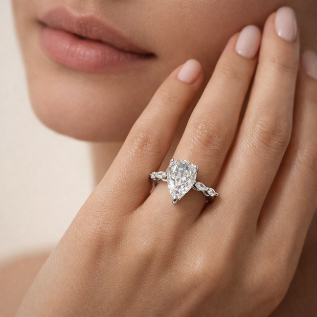 Pear Cut Solitaire Ring with Side Stones