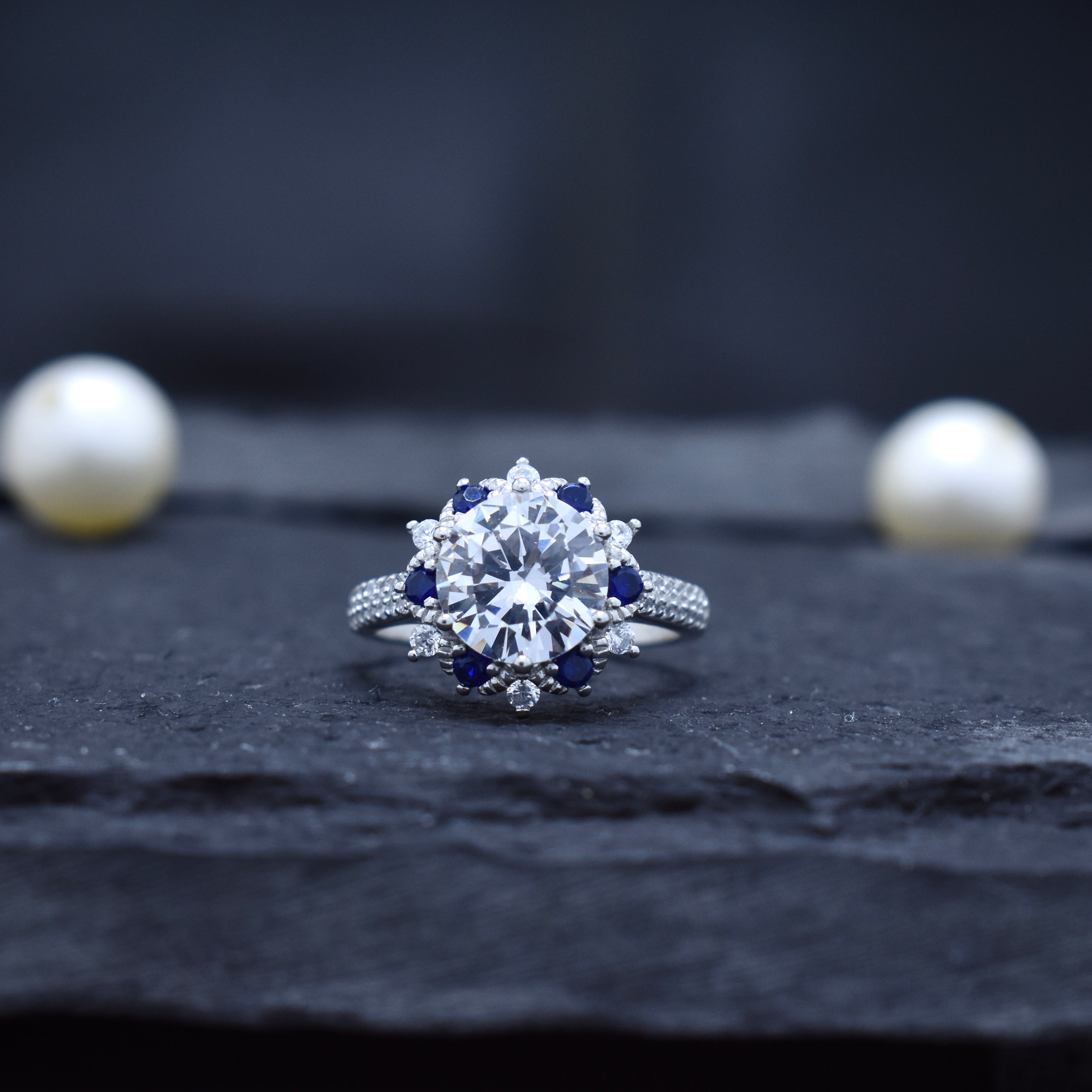 Round Cut Halo Ring with Blue Accent Stones