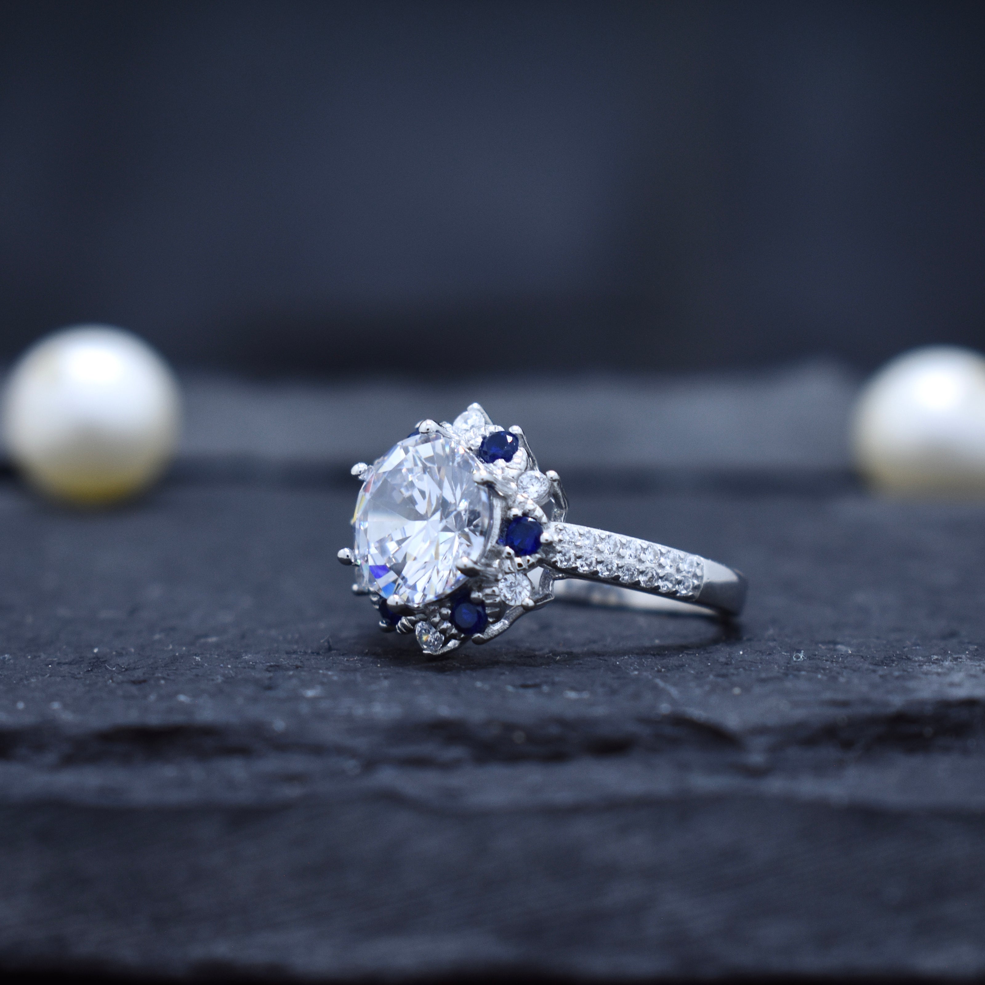 Round Cut Halo Ring with Blue Accent Stones