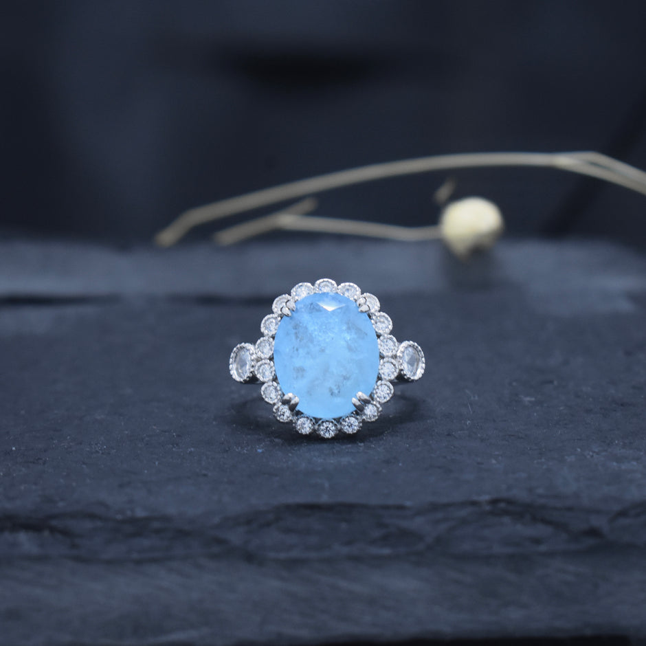 Oval Cut Sky Blue Stone Halo Ring