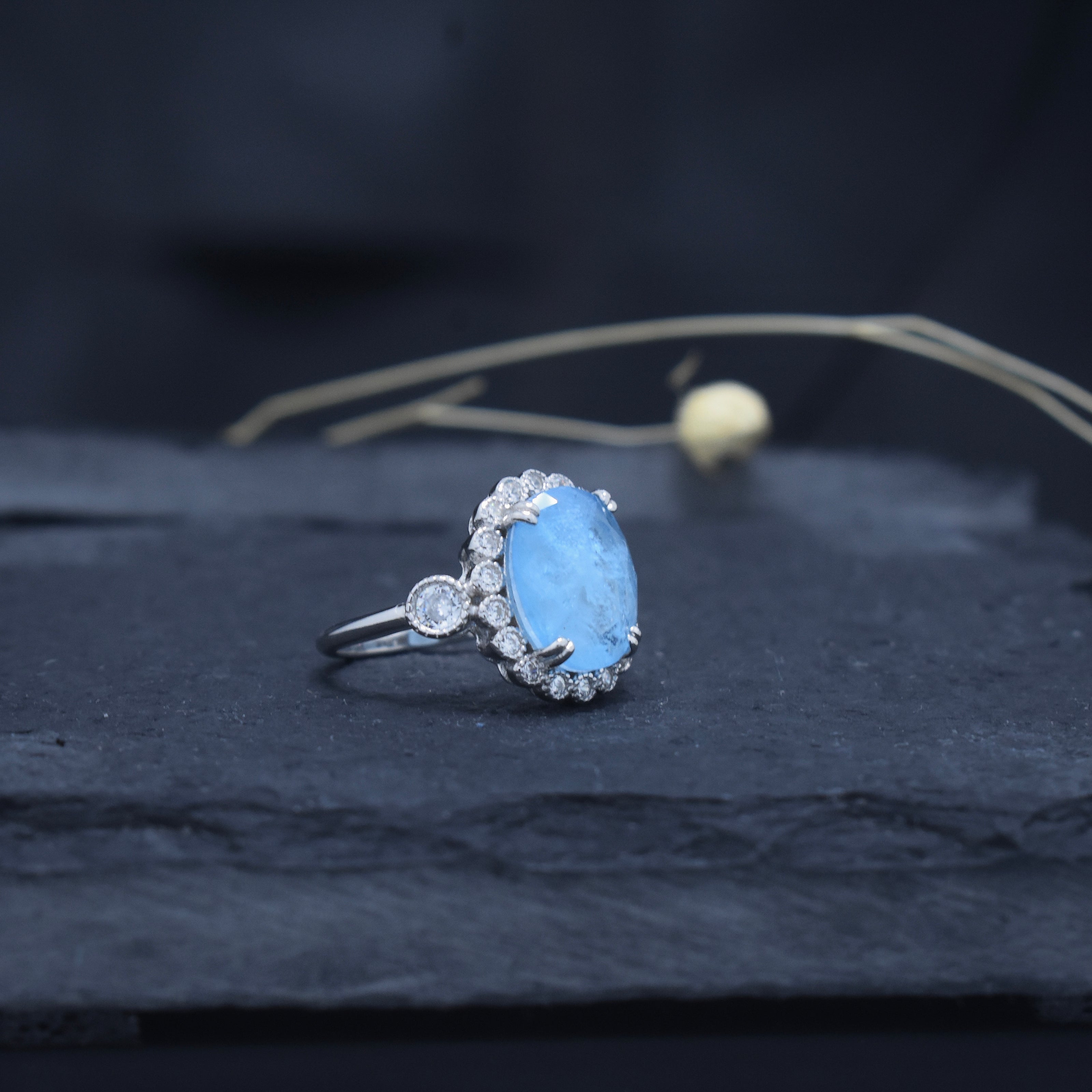 Oval Cut Sky Blue Stone Halo Ring
