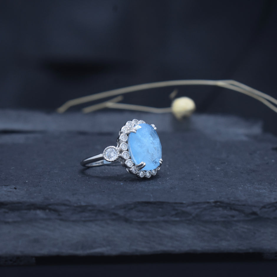 Oval Cut Sky Blue Stone Halo Ring