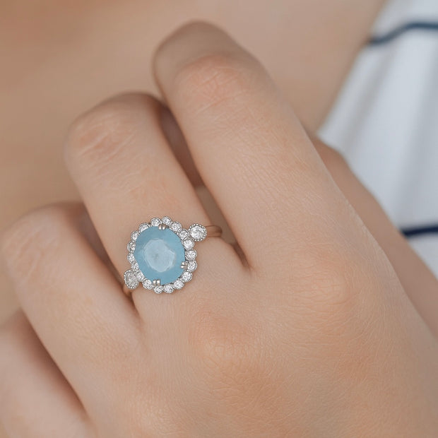 Oval Cut Sky Blue Stone Halo Ring