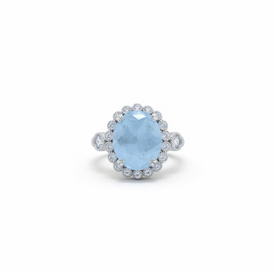 Oval Cut Sky Blue Stone Halo Ring