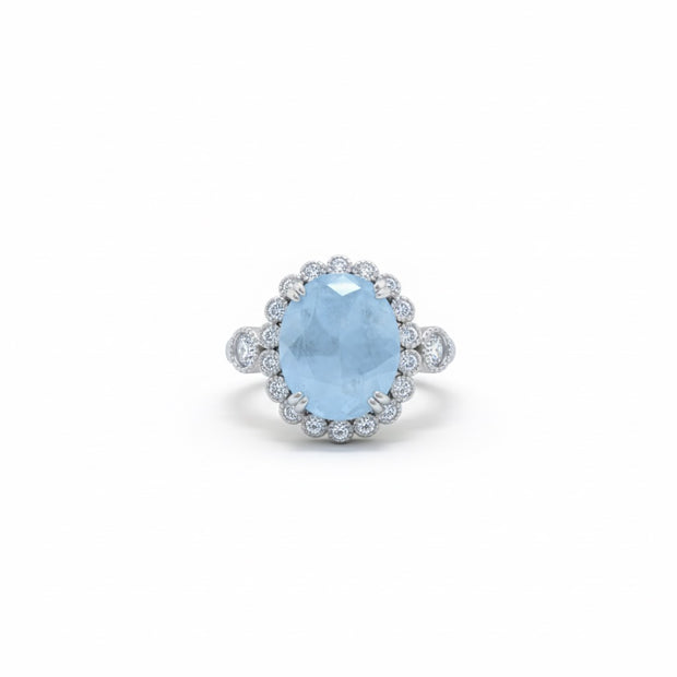 Oval Cut Sky Blue Stone Halo Ring